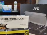 a box of food sitting on a table next to a laptop