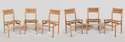 six wooden chairs are lined up in a row against a white background