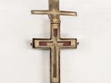 an image of a cross on a white surface with a white background