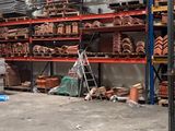a room filled with lots of different types of pottery