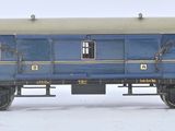 un wagon bleu immobilisé sur les rails