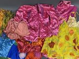 a lot of different types of dresses on a table