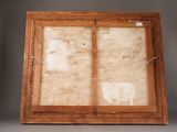 an old wooden picture frame with a picture of a cat on it