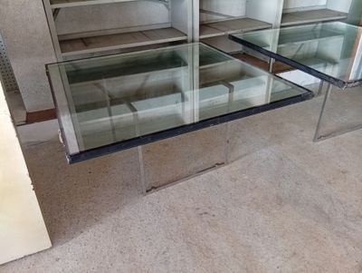 a glass table with a glass top in a room