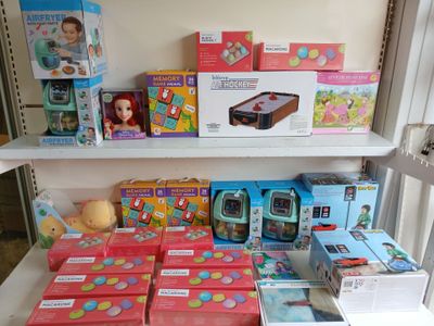 many different toys on the shelves in the room