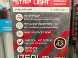 a sign that says strip light in a store