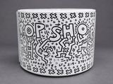 a close up of a cup with a design on it