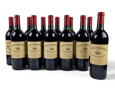 six bottles of red wine lined up in a row on a white surface
