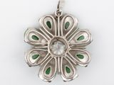 silver pendant with green and white stones on a white background