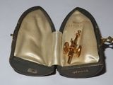 a pair of shoes that are open with a key in it