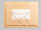 a cardboard box with a string tied to it on a gray background