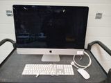 a computer sitting on a desk with a keyboard and mouse
