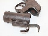two guns that are sitting on a table