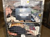 a metal cart with many items in it in a warehouse