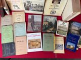 several books on a red table with a red table cloth