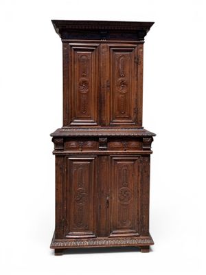 an old wooden cabinet with two doors and two drawers
