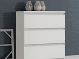 two vases on top of a white dresser in a room