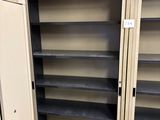 two open shelves in the middle of a room