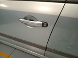 a car door handle on the side of the car