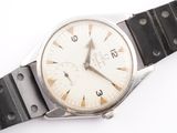 a watch that is sitting on a black strap