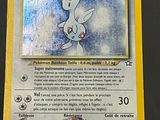 a close up of a pokemon card on a table