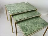 three tables that have green marble tops on them