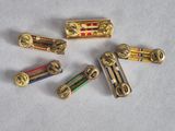 several different types of brass hardware are arranged on a white surface