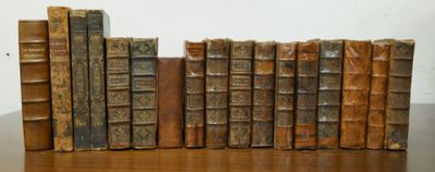 many old books sitting on a wooden table