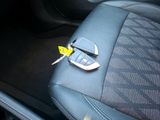 a car seat with a key in the middle of it