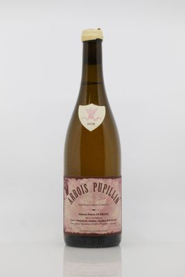a bottle of wine sitting on top of a white table