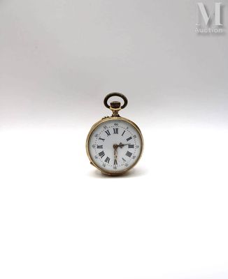 a small gold pocket watch with roman numerals on the face