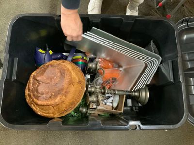 a person that is putting a pie in a trash can