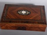 an image of a wooden box with a decorative decoration on it
