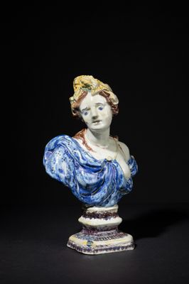 a close up of a statue of a woman on a pedestal