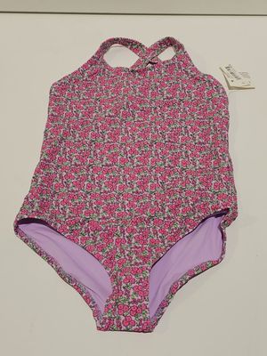 a pink and purple swimsuit with floral print on it