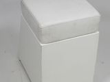 an image of a white ottoman with a cushion on top