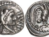 a silver coin with an image of a woman and a bird on it