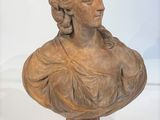 an antique bust of a woman on a pedestal with a white background