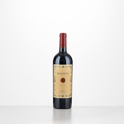 a bottle of red wine sitting on top of a table