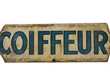 a sign that says coiffeur on a white background