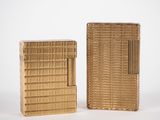 pair of gold cigarette cases, one with a lighter and the other with a lighter
