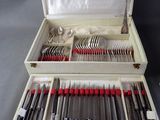 a box with silverware in it on a table