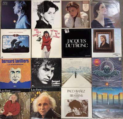 many different album covers on the wall of a room