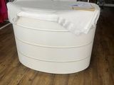 a white bath tub sitting in the middle of a room
