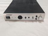 a close up of a radio sitting on top of a bed