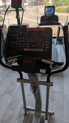 a treadmill with a laptop on top of it