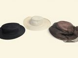 three hats are lined up on top of each other on a white surface