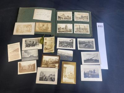 a lot of old photographs on the table