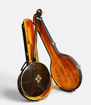 two musical instruments sitting next to each other on a white surface