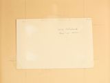 a piece of paper with writing on it sitting on a table